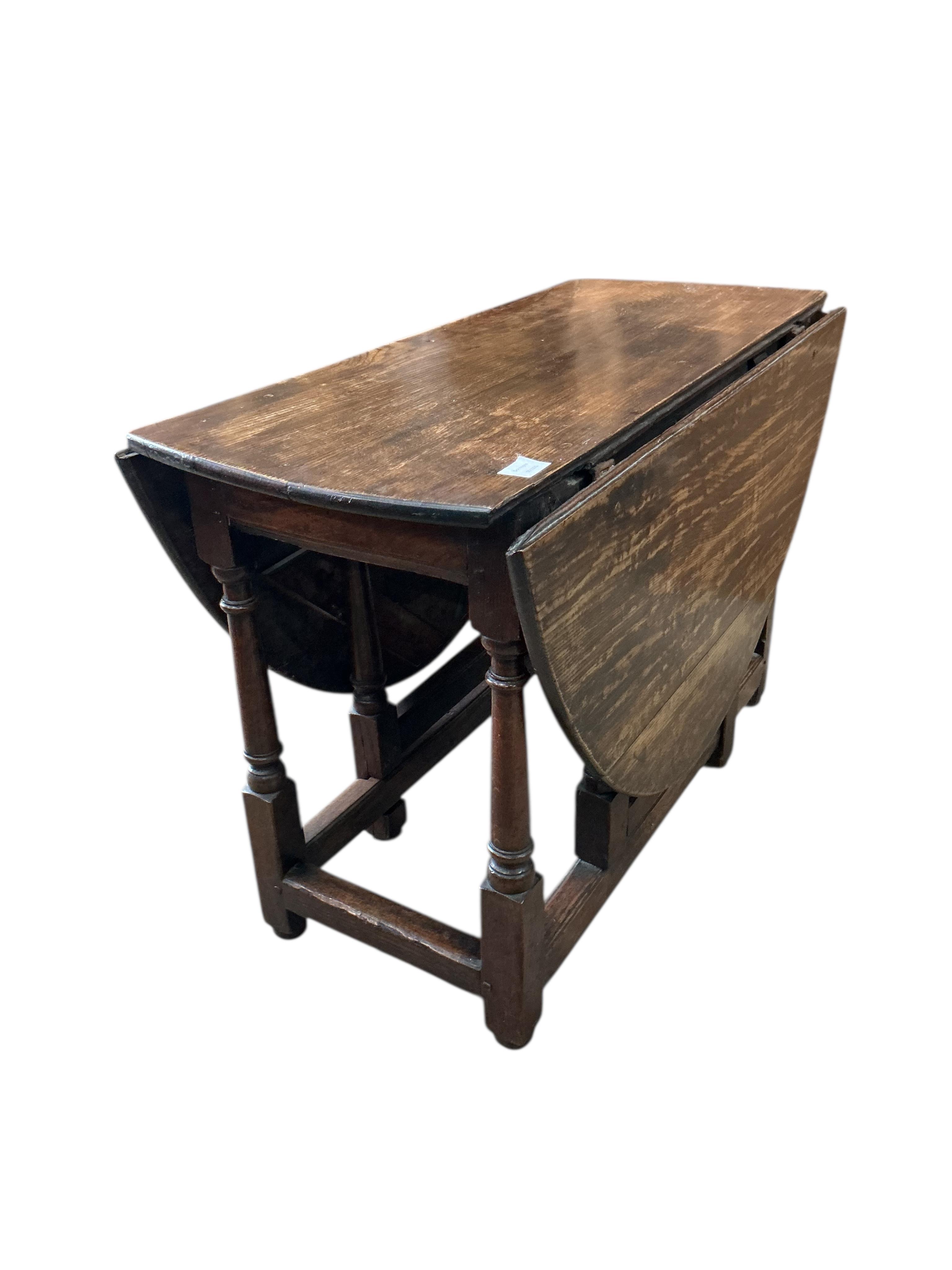 An early 18th century oak gateleg table, width 104cm, depth 47cm, height 69cm